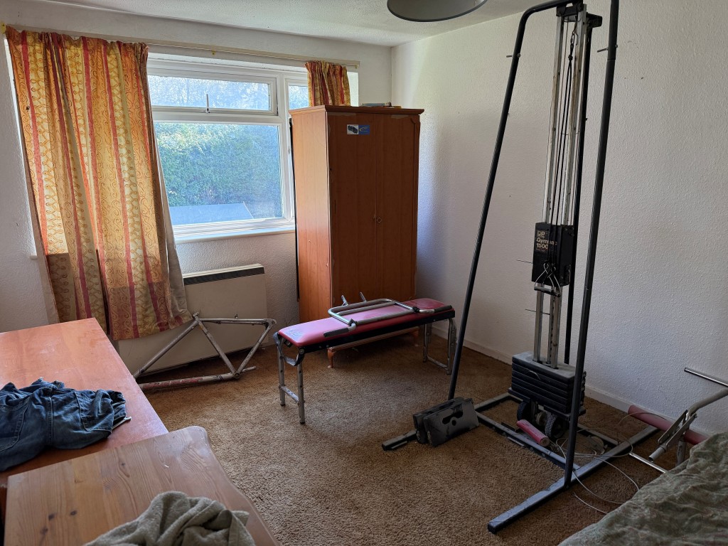 Lot: 134 - TWO-BEDROOM FLAT WITH GARAGE IN NEED OF UPDATING - Front of main bedroom with window